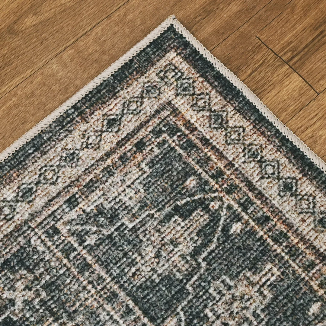 Close-up of a patterned rug on a wooden floor