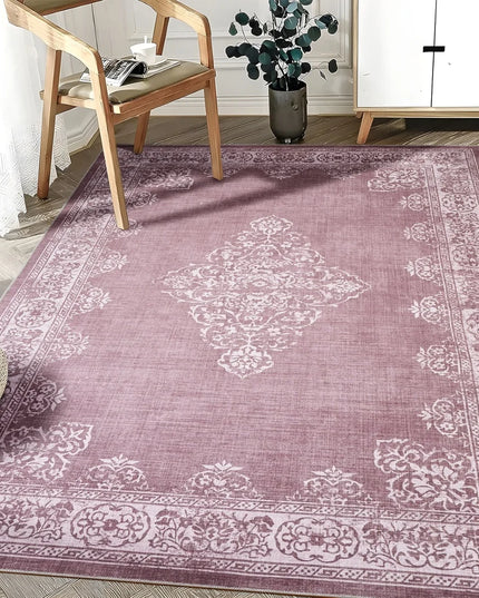 Rose patterned rug in a room with a chair and plant
