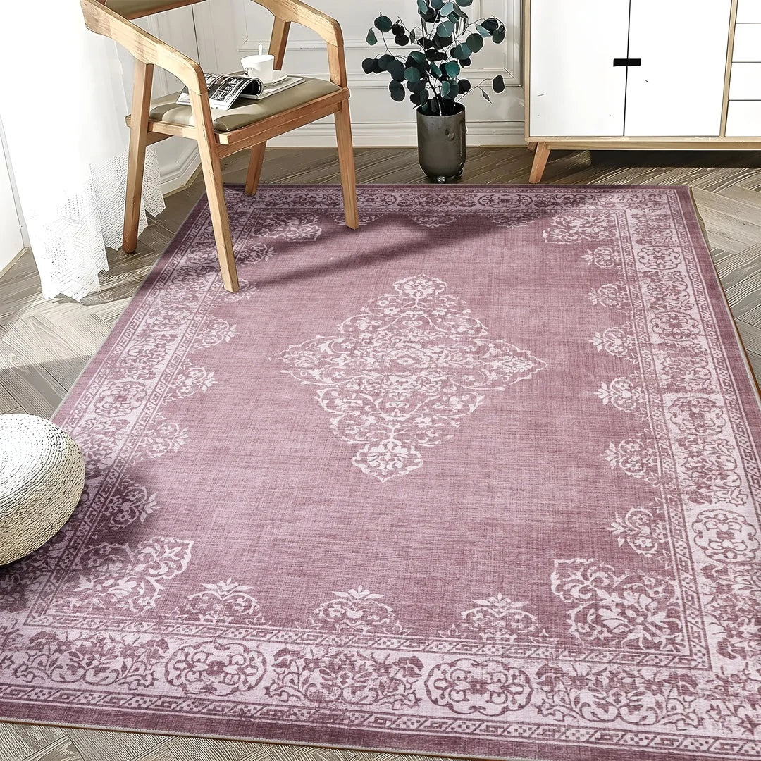 Rose patterned rug in a room with a chair and plant
