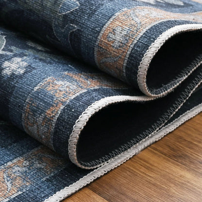 Roll of blue patterned rug on a wooden floor