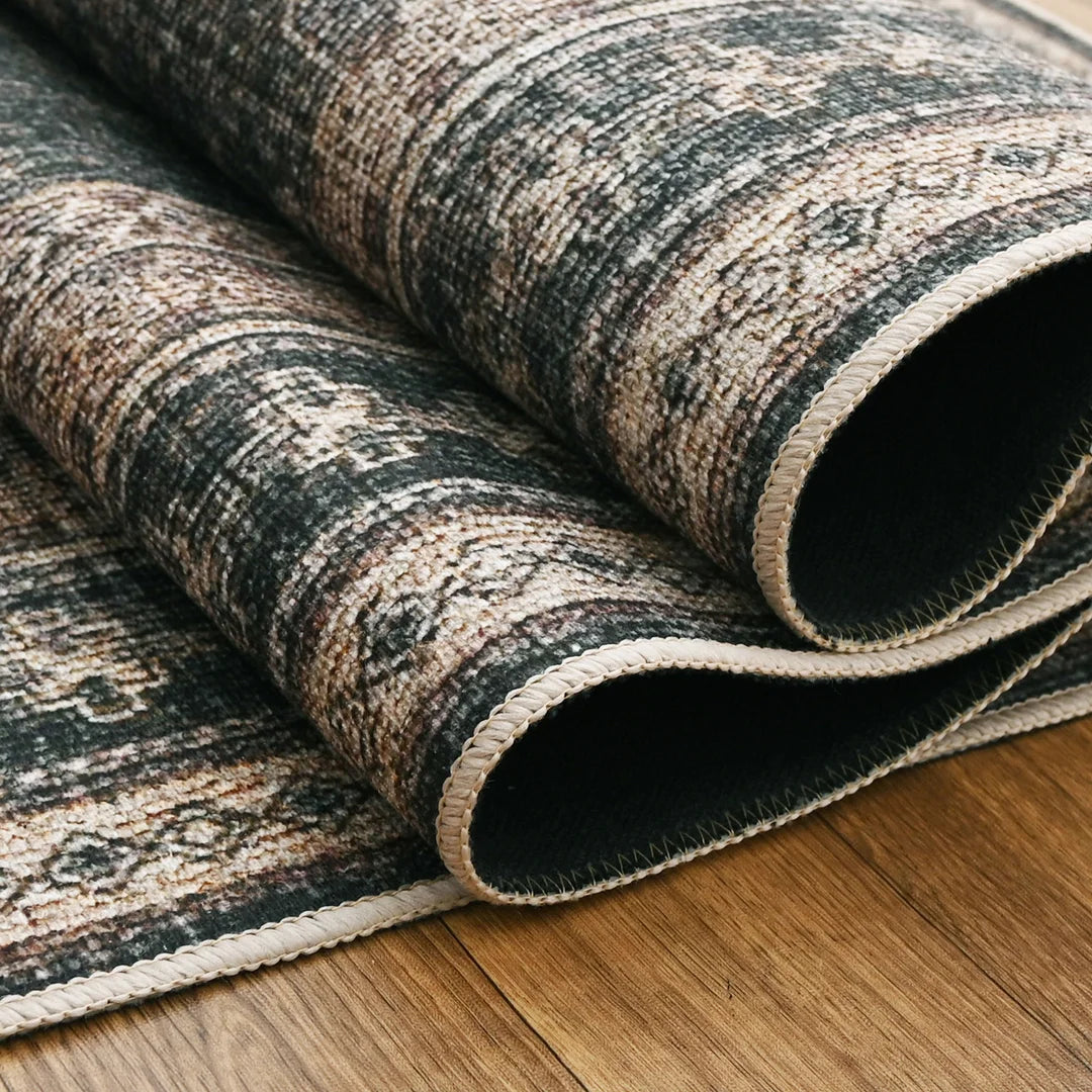Patterned rug on a wooden floor