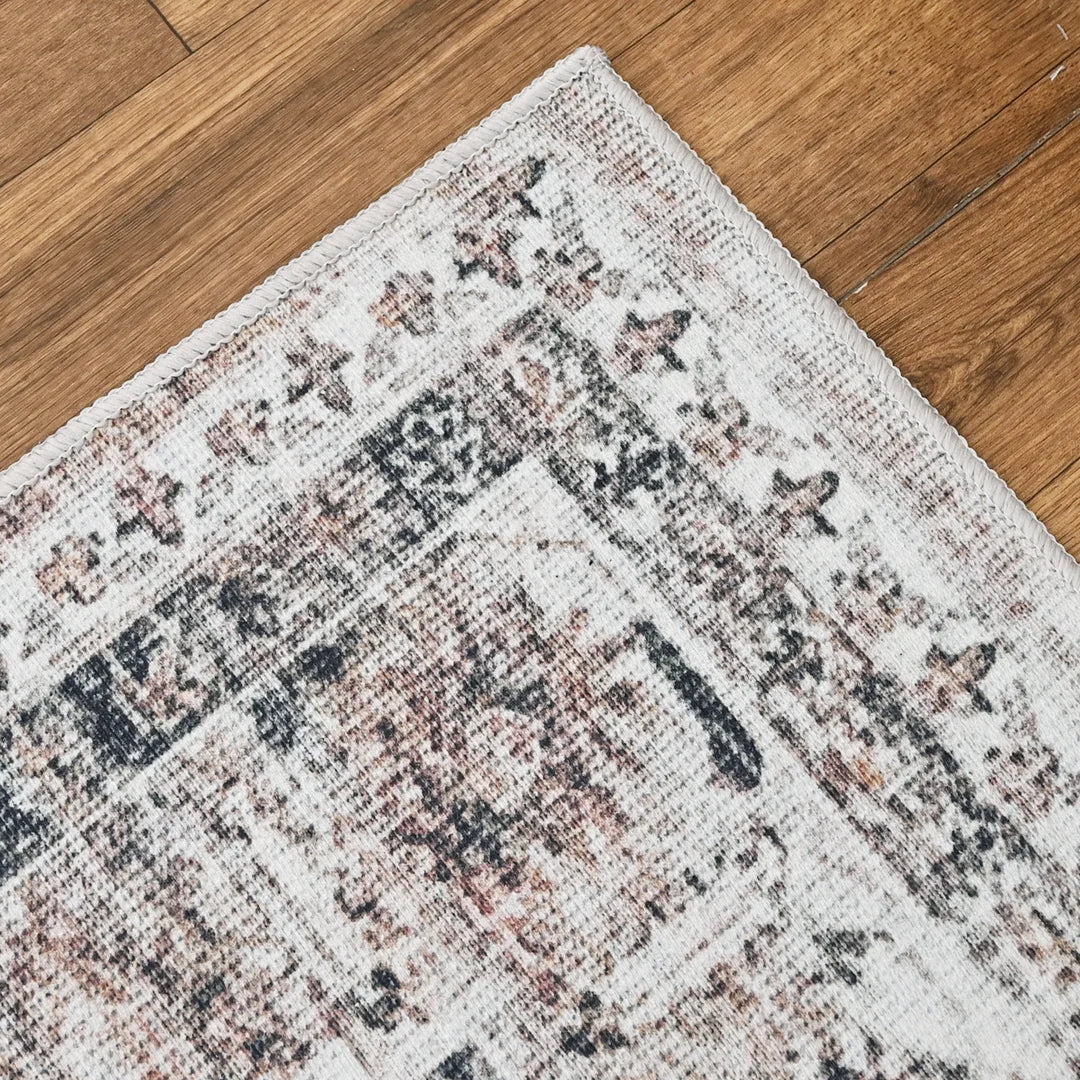 Patterned rug on a wooden floor