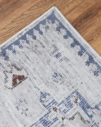 Close-up of a patterned rug on a wooden floor