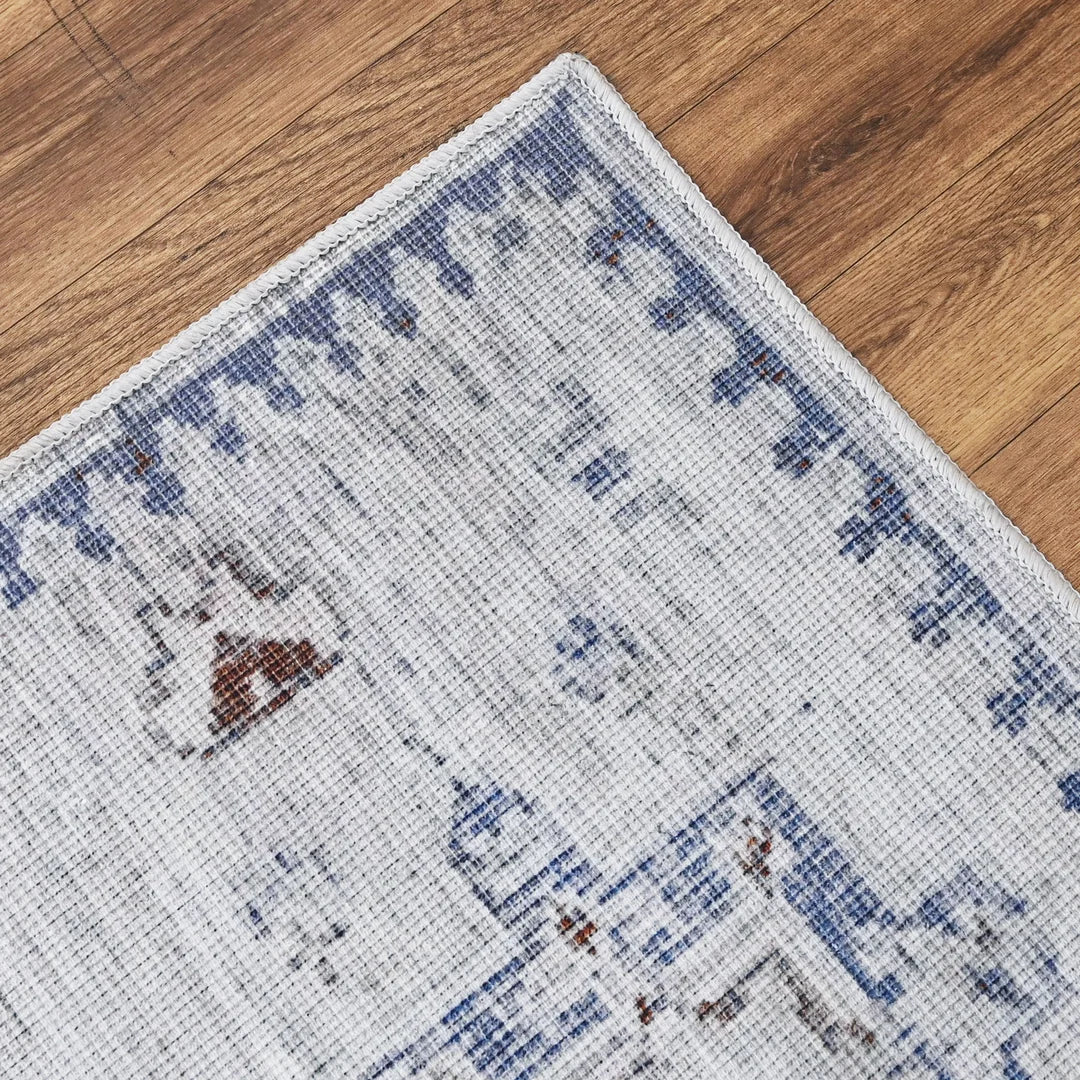 Close-up of a patterned rug on a wooden floor