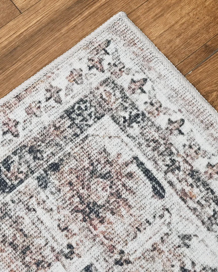 Patterned rug on a wooden floor