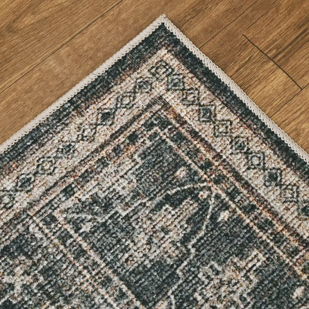 Close-up of a patterned rug on a wooden floor
