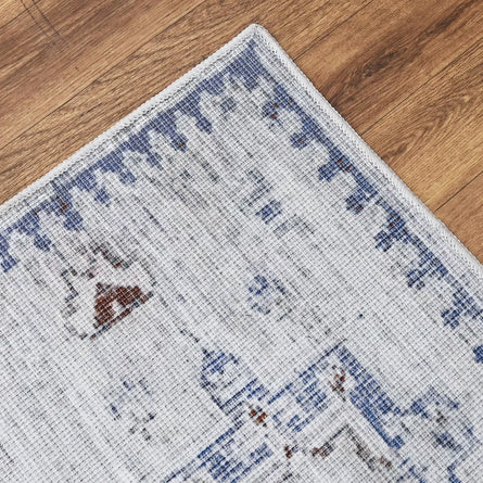 Close-up of a patterned rug on a wooden floor