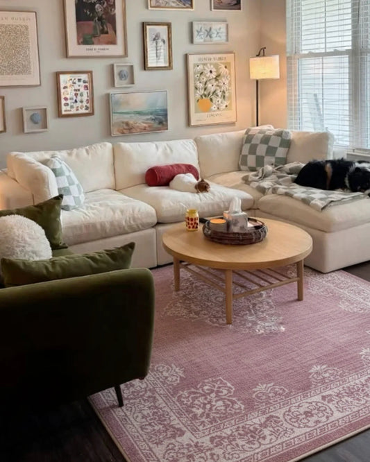Cozy living room with a white sectional sofa, coffee table, and decorative pillows.